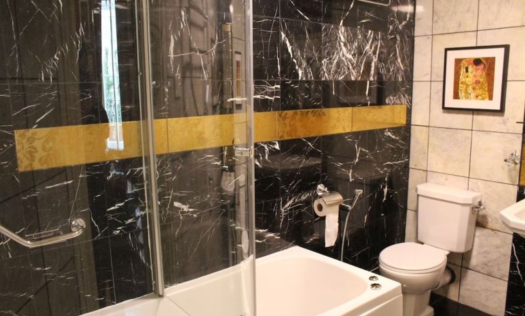 Guest bathroom at Opulence Central London Hotel.