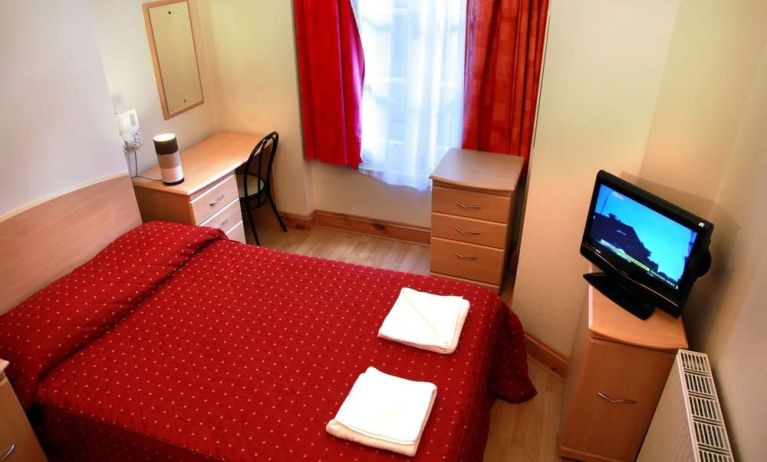 Comfortable day use room with work desk and private bathroom at Elmwood Hotel.