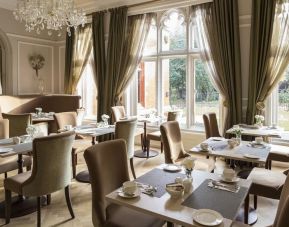 Elegant dining area with floor to ceiling windows at St Paul's Hotel.