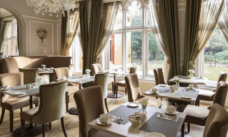 Elegant dining area with floor to ceiling windows at St Paul's Hotel.