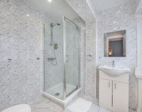 Guest bathroom with shower at King Solomon Hotel.