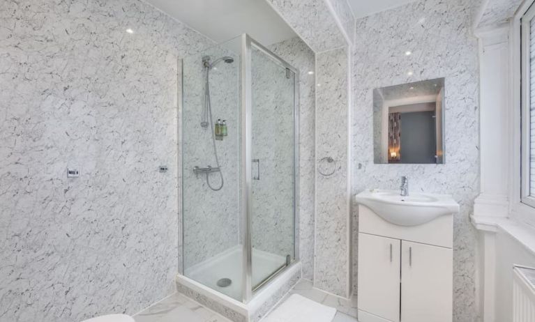 Guest bathroom with shower at King Solomon Hotel.