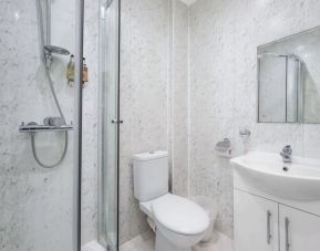 Private guest bathroom with shower and free toiletries at King Solomon Hotel.