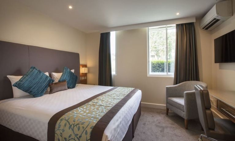 Day use room with lounge seating and work desk at Thistle London Heathrow Terminal 5 Hotel.