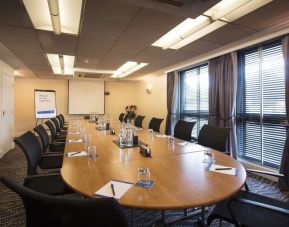 Professional meeting room with ergonomic chairs at Thistle London Heathrow Terminal 5 Hotel.