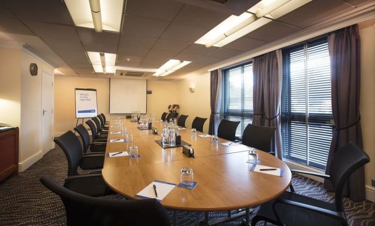 Professional meeting room with ergonomic chairs at Thistle London Heathrow Terminal 5 Hotel.