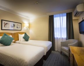 Day use twin room wth work desk and lounge seating at Thistle London Heathrow Terminal 5 Hotel.