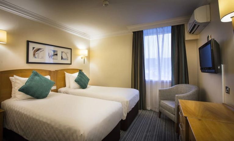 Day use twin room wth work desk and lounge seating at Thistle London Heathrow Terminal 5 Hotel.