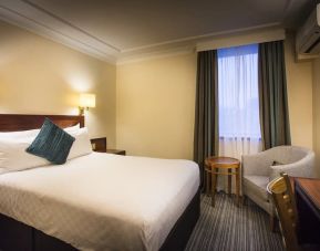 Day use room with work desk and lounge seating at Thistle London Heathrow Terminal 5 Hotel.