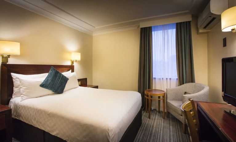 Day use room with work desk and lounge seating at Thistle London Heathrow Terminal 5 Hotel.