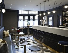 Hotel bar with lounge seating at The House Of Toby Hotel.