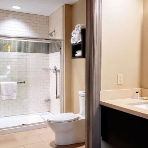 Guest bathroom with shower at Staybridge Suites Baltimore - Inner Harbor.