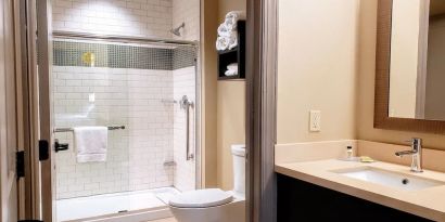 Guest bathroom with shower at Staybridge Suites Baltimore - Inner Harbor.