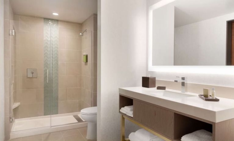 Guest bathroom with shower at Embassy Suites Boulder.
