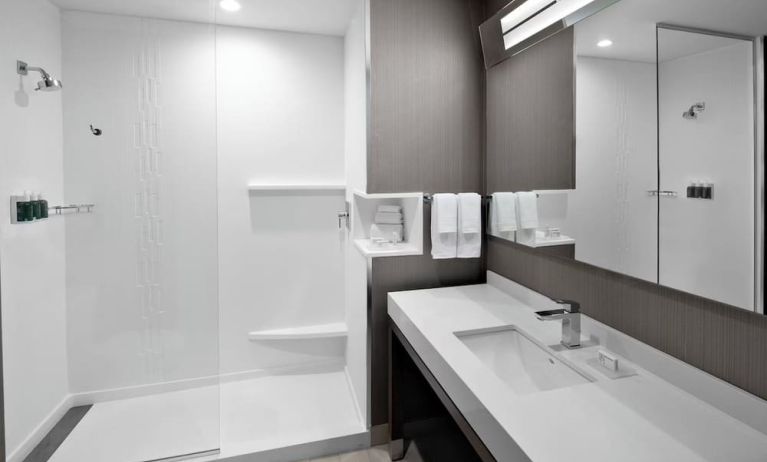 Guest bathroom with shower at Courtyard Delray Beach.
