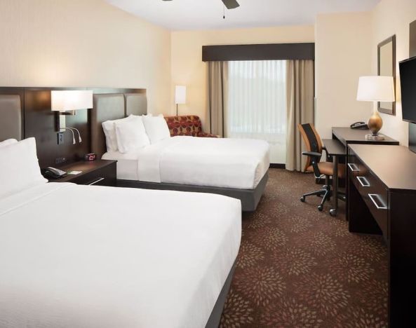 Two queen beds with work desk at Holiday Inn - Trophy Club.