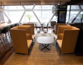 Ample seats with natural light perfect for coworking at Airport Lounge - JFK Terminal 1.