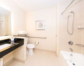 Guest bathroom with shower at Best Western San Diego Zoo/SeaWorld Inn & Suites.