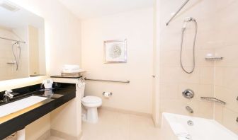 Guest bathroom with shower at Best Western San Diego Zoo/SeaWorld Inn & Suites.