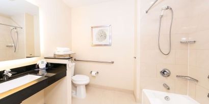 Guest bathroom with shower at Best Western San Diego Zoo/SeaWorld Inn & Suites.