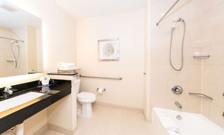 Guest bathroom with shower at Best Western San Diego Zoo/SeaWorld Inn & Suites.