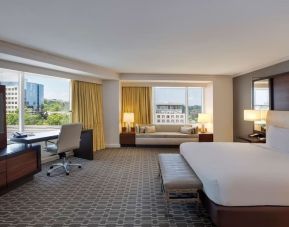 Spacious day use room with work desk and sofa at Hilton McLean Tysons Corner.