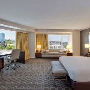 Spacious day use room with work desk and sofa at Hilton McLean Tysons Corner.