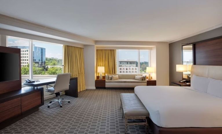 Spacious day use room with work desk and sofa at Hilton McLean Tysons Corner.