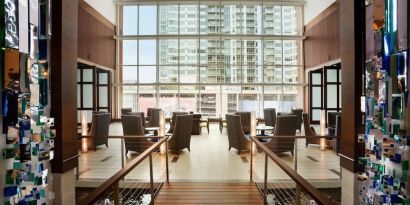 Lobby and coworking lounge at Embassy Suites By Hilton Denver Downtown Convention Center.