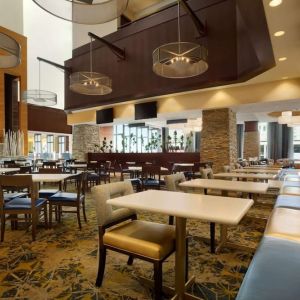 Dining area perfect for coworking at Embassy Suites By Hilton Denver Downtown Convention Center.