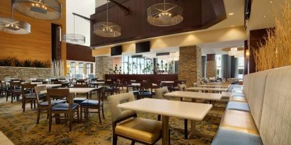 Dining area perfect for coworking at Embassy Suites By Hilton Denver Downtown Convention Center.