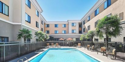 Refreshing outdoor pool at Courtyard Bossier City.