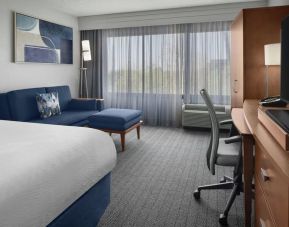 Day use room with sofa and work desk at Courtyard By Marriott Cypress Anaheim.