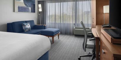 Day use room with sofa and work desk at Courtyard By Marriott Cypress Anaheim.