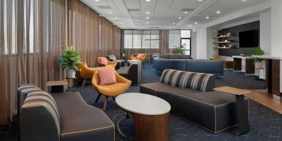 Lobby and coworking lounge at Courtyard By Marriott Cypress Anaheim.