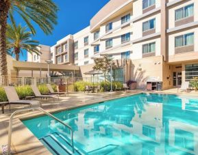 Refreshing outdoor pool at Courtyard By Marriott Santa Ana Orange County.