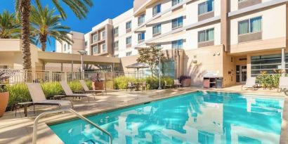 Refreshing outdoor pool at Courtyard By Marriott Santa Ana Orange County.