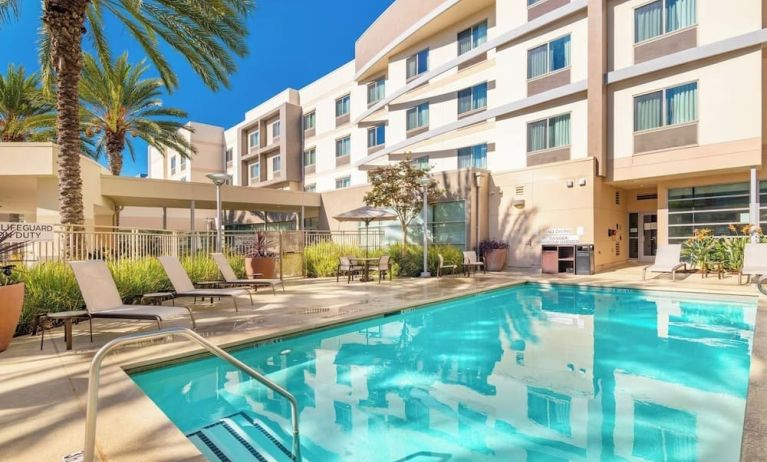 Refreshing outdoor pool at Courtyard By Marriott Santa Ana Orange County.