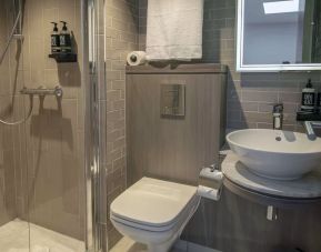 Private bathroom with shower and free toiletries at Best Western Plus Vauxhall Hotel.