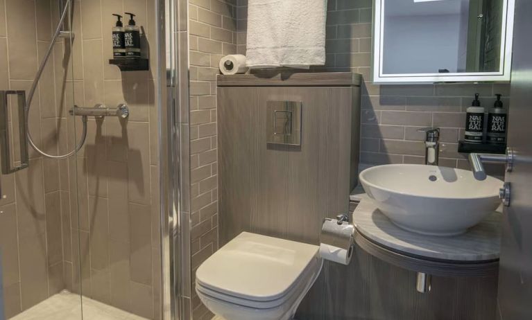 Private bathroom with shower and free toiletries at Best Western Plus Vauxhall Hotel.