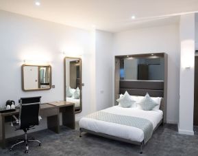 Bright and spacious day use room with work desk at Atrium Hotel Heathrow.