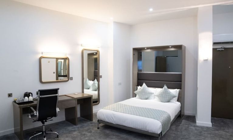 Bright and spacious day use room with work desk at Atrium Hotel Heathrow.