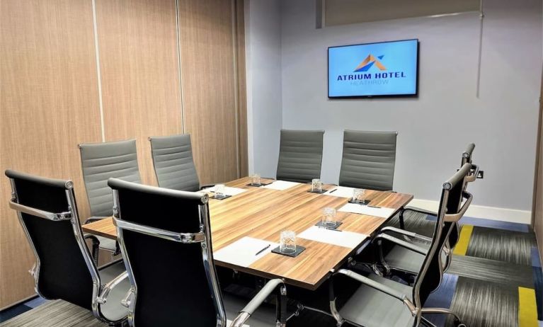 Professional meeting room with ergonomic chairs at Atrium Hotel Heathrow.