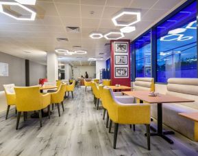 On-site coffee shop with lounge seating, perfect for co-working at Atrium Hotel Heathrow.