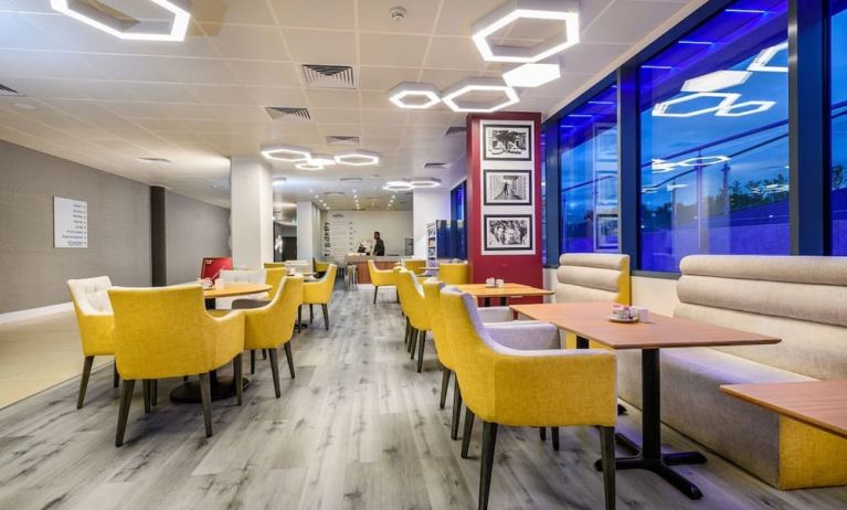 On-site coffee shop with lounge seating, perfect for co-working at Atrium Hotel Heathrow.