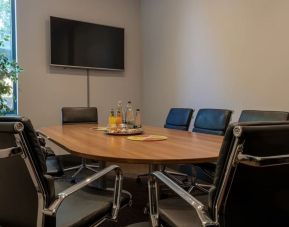 Professional meeting room at London City Airport Hotel.