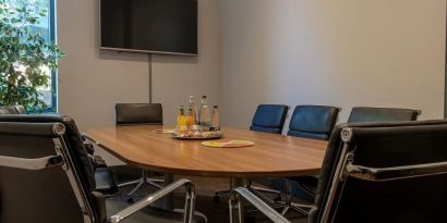 Professional meeting room at London City Airport Hotel.