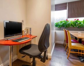 Workspace with computer and ergonomic chair at Comfort Inn Edgware Road.