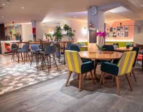 Dining area with comfortable seating at The Corner London City.