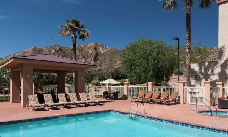 Refreshing outdoor pool at Courtyard By Marriott Santa Clarita Valencia.